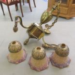 An early 20thC lacquered brass three branch light fitting with flared bell design mottled multi-
