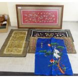 One framed and four loose 20thC Oriental textiles: to include a blue silk unframed panel of cranes