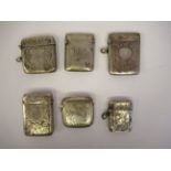 Five similar silver vesta cases with hinged caps and strike plates  mixed marks