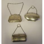 Three dissimilar late 19th/early 20thC silver folding purses on chain handles, enclosing hide