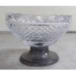 A cut glass centrepiece with shell and repeating diamond shaped formations  9"dia, set on an early/