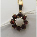 A 9ct gold opal and garnet set pendant, on a fine neckchain and ring bolt clasp