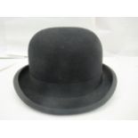A Christies of London black bowler hat, interior size label 7.5 59