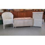 Three items of Lloyd Loom furniture: to include a tub design conservatory chair, raised on turned