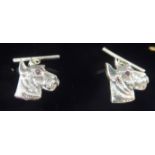A pair of Sterling silver dogs' head cufflinks with glass eyes