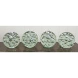 A set of four clear glass door stops with interior bubbled ornament  5"h