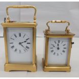 Two similar 20thC brass cased carriage timepieces with bevelled glass panels and folding top