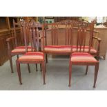 An Arts & Crafts pewter and ebony inlaid oak salon suite  comprising a three person settee, an