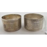 A pair of silver napkin rings with engraved and engine turned decoration  Birmingham 1911  cased
