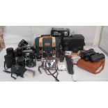 Photographic equipment and accessories: to include Minolta lenses; a Canon E05 50E; and a pair of