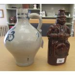 A 19thC treacle glazed earthenware liqueur bottle, fashioned as a portly man wearing a hat and