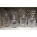 Seven cut lead crystal decanters of varying designs  10"-12"h