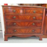 A modern reproduction of a Georgian mahogany dressing chest with two short/three graduated long