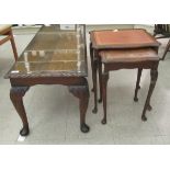 A mid 20thC walnut finished coffee table with a carved edge, raised on cabriole legs  17"h  42"w;