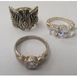 Three dissimilar silver coloured metal dress rings
