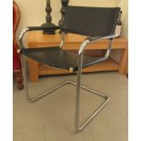 A circa 1960s chromium plated, tubular framed chair, the black hide sling back and seat raised on