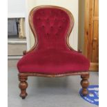 A late Victorian mahogany showwood framed salon chair, the part button, red fabric covered back