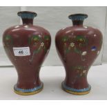 A pair of 20thC cloisonné vases of waisted, baluster form, having narrow necks and flared rims,