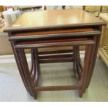 A nesting set of three G-Plan teak occasional tables, raised on splayed legs  largest 20"h  19"w