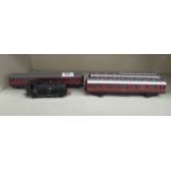 A Bachmann 00 gauge 0-6-0 model railway locomotive and three passenger coaches