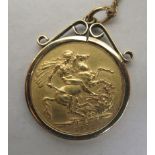 A George V sovereign, St George on the obverse  1912, in a 9ct gold mount, on a fine neckchain