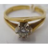 An 18ct gold single stone, claw set diamond ring