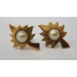 A pair of gold coloured metal engraved leaf and pearl set earrings