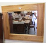 A modern light oak framed mirror with a plain plate  28" x 32"