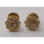 A pair of 22ct diamond set cluster earrings