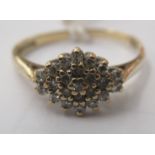 A 9ct gold, claw set diamond cluster ring