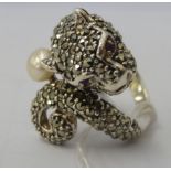 A silver panther ring, set with marcasite and a seed pearls