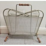 A two division wire and mesh framed magazine rack with bamboo handle and splayed feet  15"h  16"w