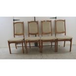 A set of four Hoffer of Denmark teak framed dining chairs, the original textured, beige coloured