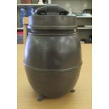 A late 19th/early 20thC pewter, barrel design tobacco jar with a folding ring handle on the cover