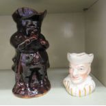 Character jugs: to include a late Victorian treacle glazed pottery example  10.5"h