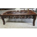 An early 20thC rosewood finished Chinese design occasional table, the top with a mitred border, over