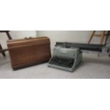 A mid 20thC typewriter  bears a plaque 'Property of Ford Motor Co' 12980; and a sewing machine