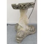 A composition stone birdbath, the base fashioned as three stylised dolphins  17"h