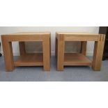 A pair of modern light oak coffee tables, raised on square legs  19"h  23"sq