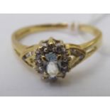 An 18ct gold, claw set, single white stone ring