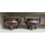 A pair of modern Chinese overpainted bronze censors  bears impressed six character marks  4"h