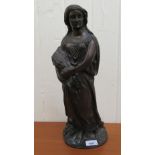 A 20thC cast bronze figure, a woman carrying a wheatsheaf  16"h