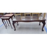 A mid 20thC walnut finished coffee table with a carved edge, raised on cabriole legs  17"h  42"w;