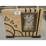 A 1930s Art Deco marble cased mantle clock; the movement faced by a silver coloured metal Arabic