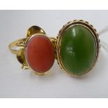 Two dissimilar 18ct gold dress rings, one set with coral, the other jade