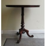 A reproduction of a Victorian mahogany pedestal table, on a loaded base  29"h  26"dia