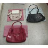 Three Radley handbags; and a Radley purse