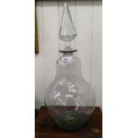 A 20thC 'oversized' glass decanter of bulbous form with a stopper  22"h overall