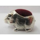 A silver coloured metal novelty pin cushion, fashioned as a guinea pig  stamped 925