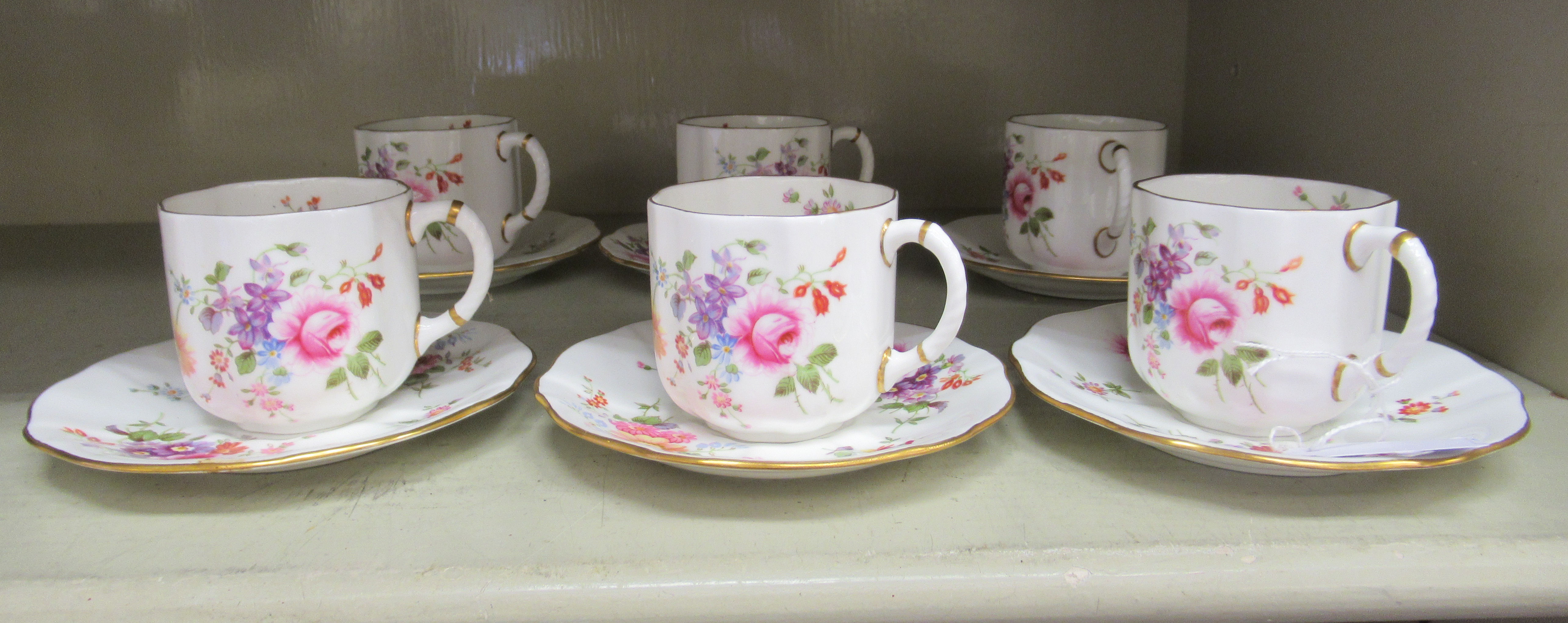 A set of six Royal Crown Derby bone china Derby Poses pattern cups and saucers